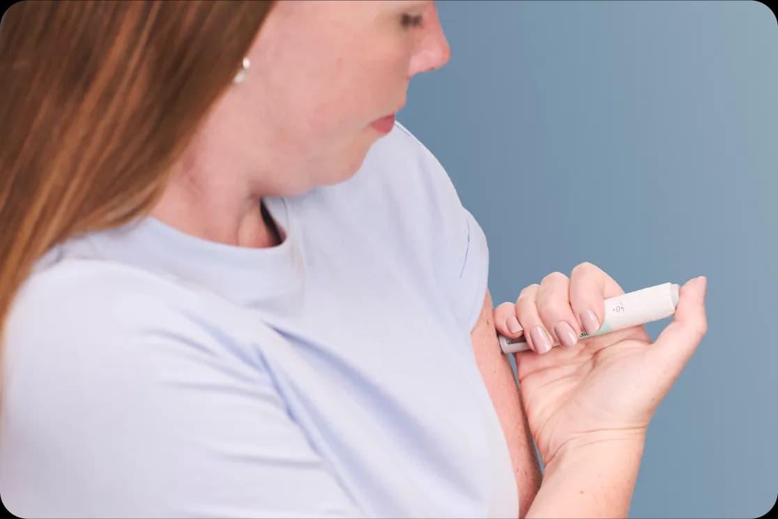 Woman using injectable pen