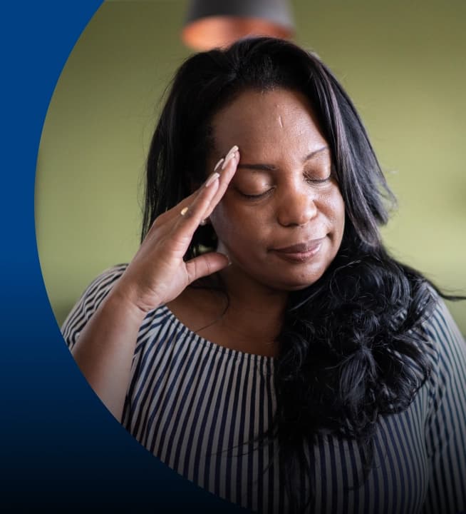 Woman holding her head in pain